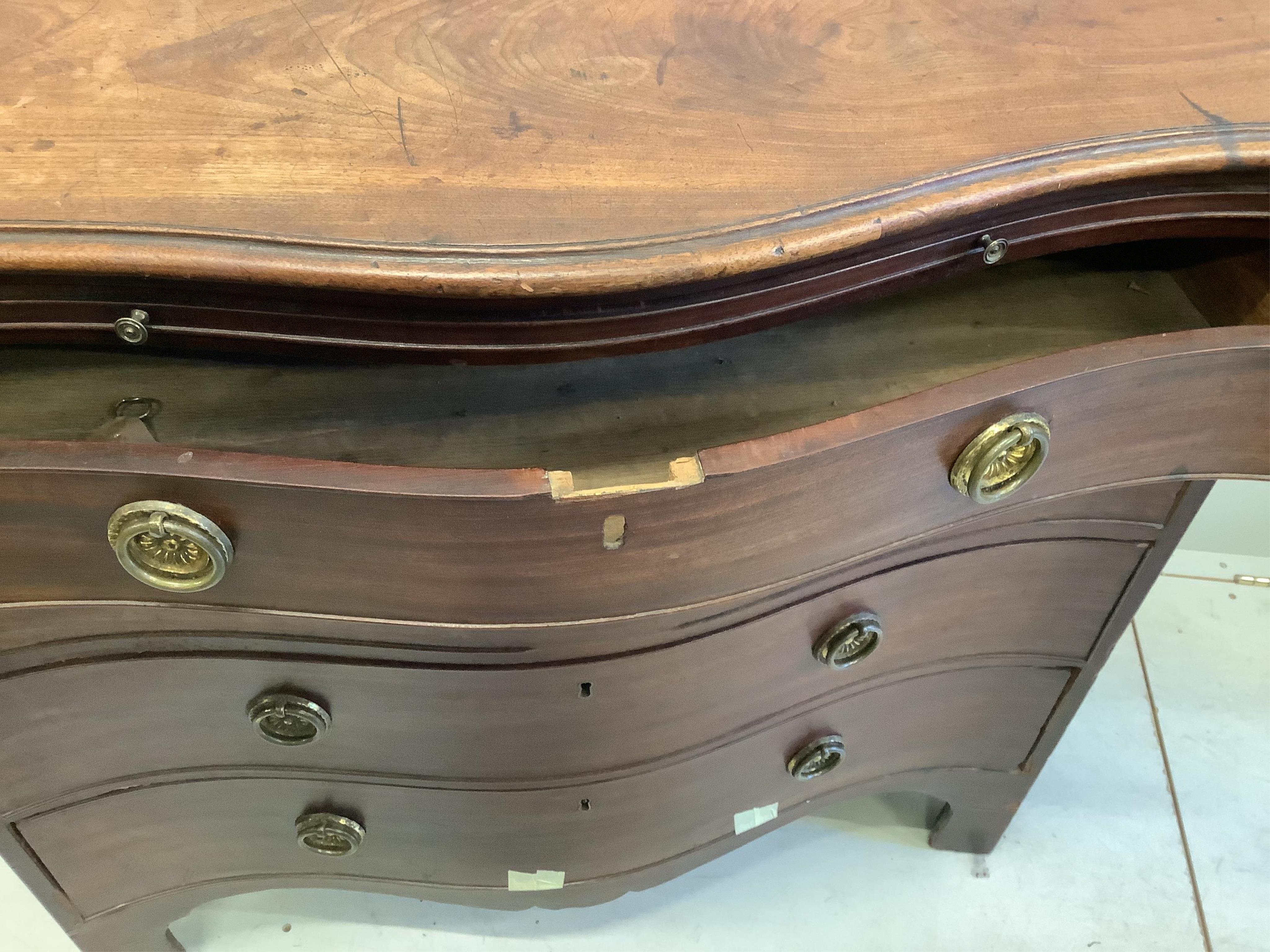 A George III mahogany serpentine chest with brushing slide, width 95cm, depth 52cm, height 91cm
